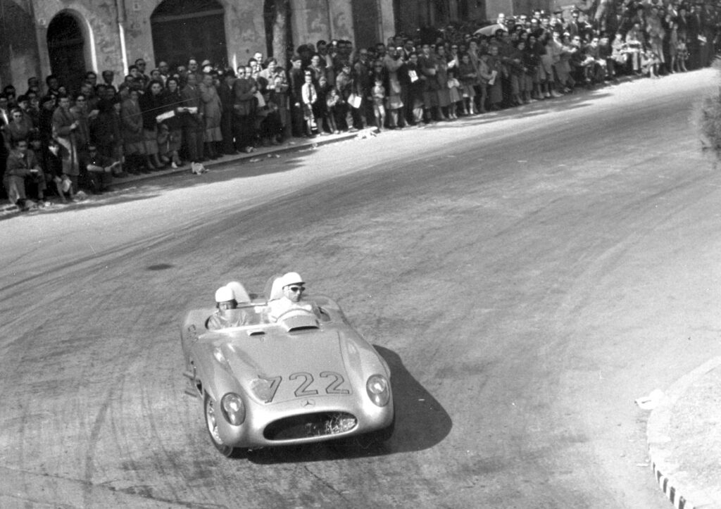 The 1955 Mille Miglia winners, Stirling Moss/Denis Jenkinson, after 303 kilometers of driving in Ravenna (above)