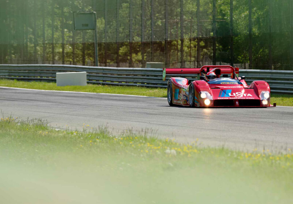 trackday-marco-werner-in-Ferrari-333-SP-curbs-historic-motorsport